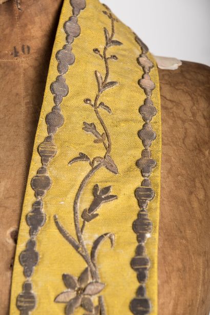 null Stole decorated with embroidery on a yellow background, two tears in the li...