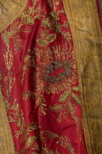 null Garment embroidered gold on red background.

Small accidents