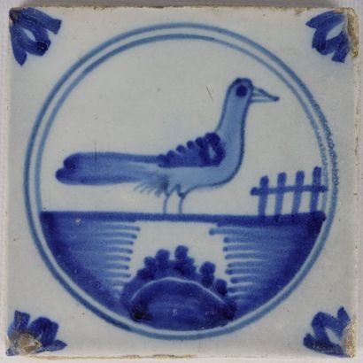 null DESVRES.

Four tiles decorated with landscapes and bird, one polychrome decorated...