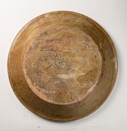 null Glazed earthenware dish, decorated with pastillage of a knight flanked by two...