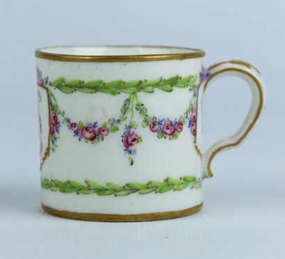 null SEVRES.

Porcelain cup and saucer, decorated with garlands of flowers and the...