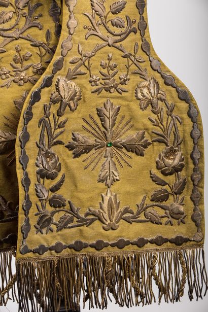 null Stole decorated with embroidery on a yellow background, two tears in the li...