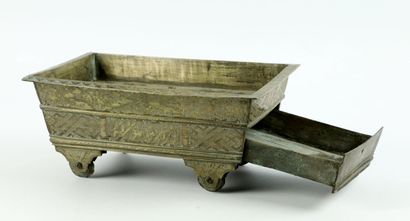 null PERSIA or NORTH AFRICA.

Chased brass child's toy forming a cart, on a wheel,...