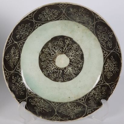 null PERSIA.

Two ceramic dishes, one decorated with calligraphy, the other with...
