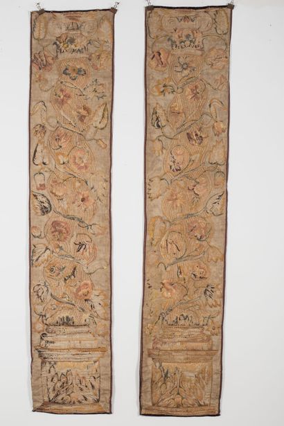 null Pair of large polychrome embroideries, on a purple velvet background.

They...