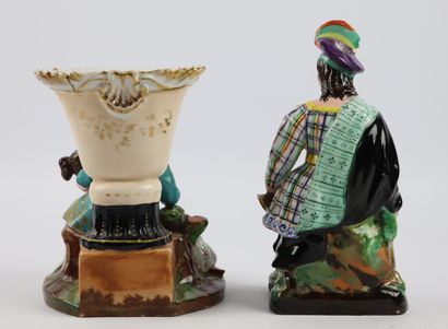 null PARIS.

Two groups in polychrome and gold porcelain, one decorated with a scottish,...