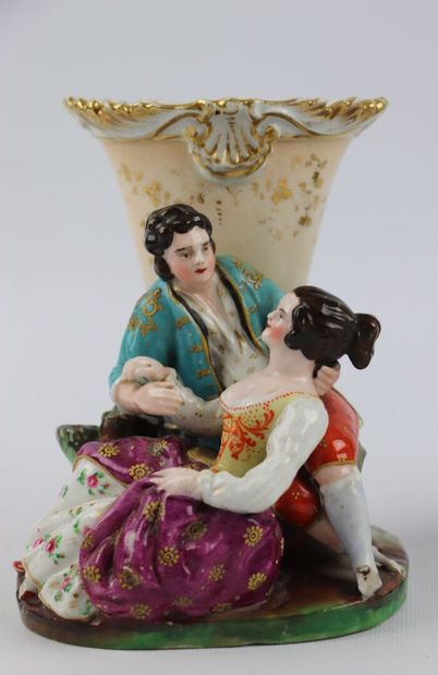 null PARIS.

Two groups in polychrome and gold porcelain, one decorated with a scottish,...