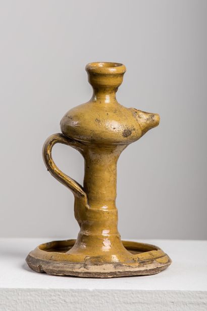 null Oil lamp in yellow glazed earth.

H_19,7 cm