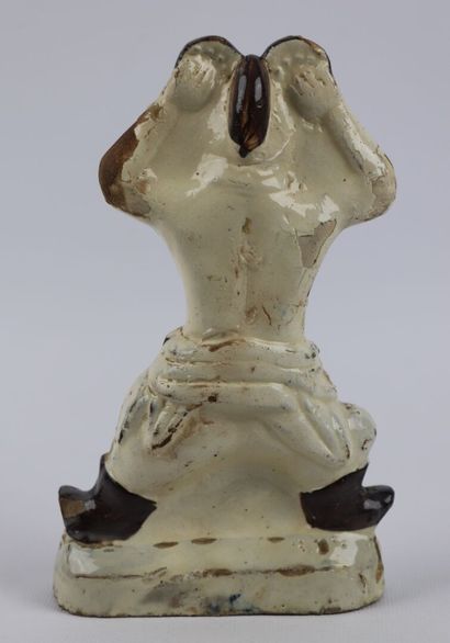 null CHINA (?).

Character in white enamelled stoneware, with brown and blue decoration.

H_18,7...