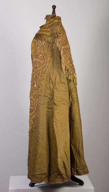 null Cape with rich embroidered decoration on a golden yellow background.

The hood...