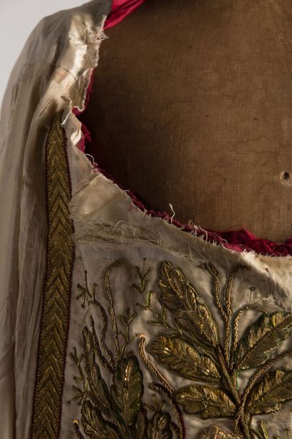 null Mantle with rich embroidered decoration of flowering branches.

Missing the...