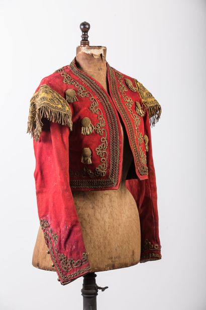 null Set of regional textiles and theater including :

a small embroidered vest.

two...