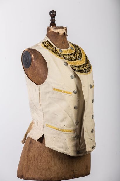 null Set of regional textiles and theater including :

a small embroidered vest.

two...