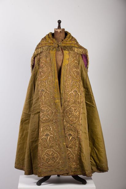 null Cape with rich embroidered decoration on a golden yellow background.

The hood...