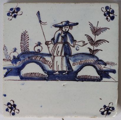 null DELFT.

Four tiles in faÎence with decoration in blue monochrome, one highlighted...