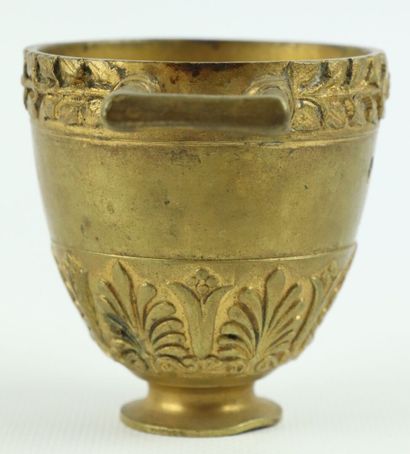 null Set of bronze and brass objects including :

a vase with handles in the Greek,...