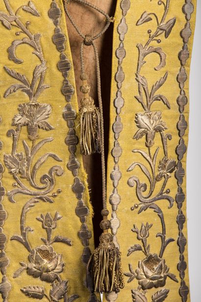 null Stole decorated with embroidery on a yellow background, two tears in the li...