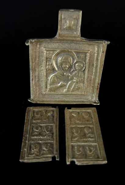 null Two orthodox travel icons in bronze, one decorated with St. George slaying the...