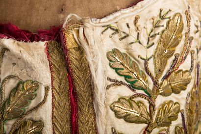 null Mantle with rich embroidered decoration of flowering branches.

Missing the...