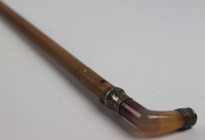 null Cane, the pommel in agate, mounted in embossed and chased silver, the shaft...