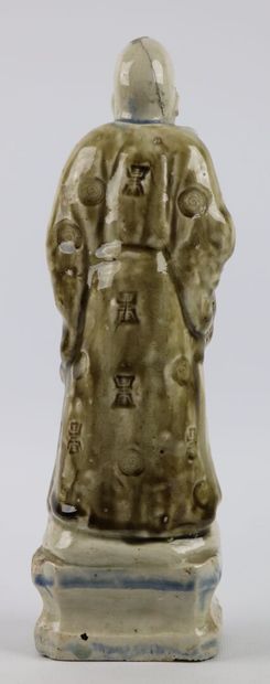 null CHINA.

Enamelled stoneware statuette representing Shou-Lao holding the peach...