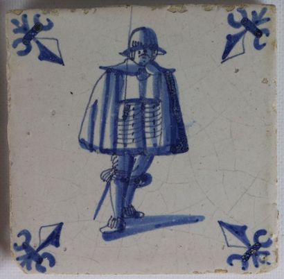 null DELFT.

Four tiles in faÎence with decoration in blue monochrome, one highlighted...
