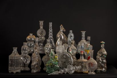 null Collection of 36 molded glass bottles.

Some with, others without stoppers.

We...