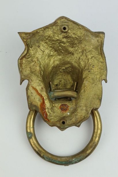 null Heurtoir en bronze à décor de mufle de lion.

H_17,7 cm