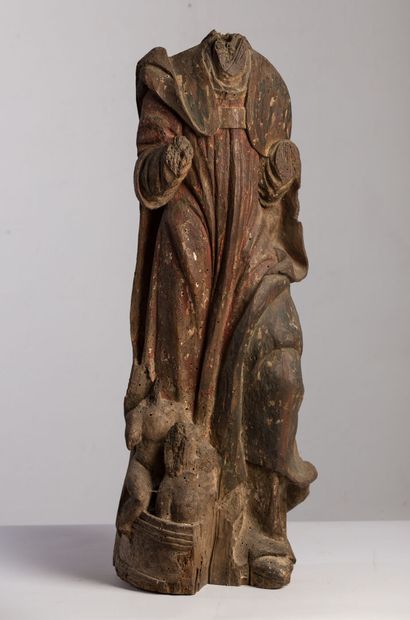 null Saint Nicolas acéphale en bois sculpté polychrome.

Début du XVIIème siècle.

H_79...