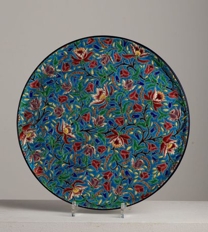 null LONGWY.

Circular dish in earthenware and polychrome cloisonné enamels decorated...