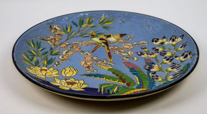 null LONGWY.

Large earthenware dish decorated with polychrome enamels showing parakeets...