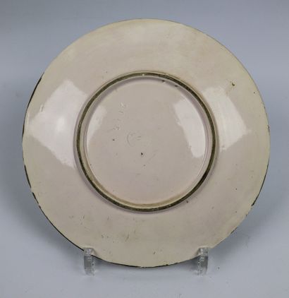 null LONGWY.

Earthenware plate with painted polychrome decoration of a house in...