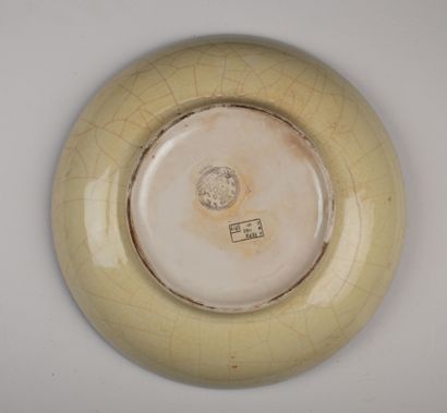 null LONGWY.

Earthenware dish decorated with polychrome enamels featuring pineapples...
