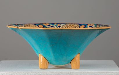 null LONGWY.

Earthenware tripod bowl decorated with geometrical and floral polychrome...