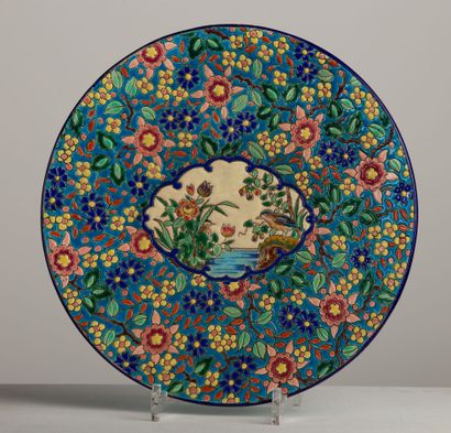 null LONGWY.

Earthenware dish and polychrome cloisonné enamels with bird and flower...