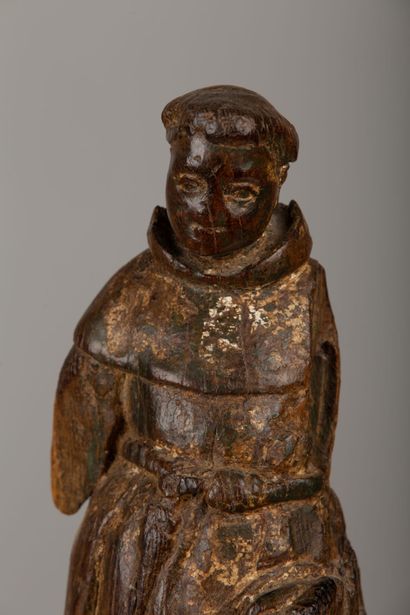 null Statuette en bois sculpté figurant un moine, le visage arrondi.

Espagne, XVIIème...