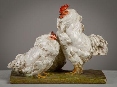 null Groupe en grès émaillé figurant un coq avec deux poules.

Travail italien moderne,...