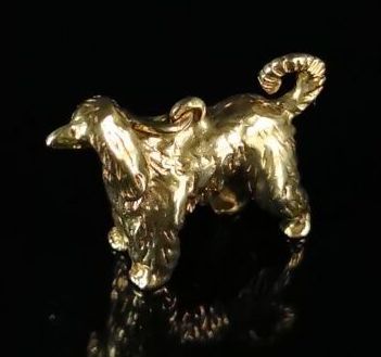 null Yellow gold pendant featuring an Afghan greyhound.

L_24 mm.

11.19 grams, 14K,...