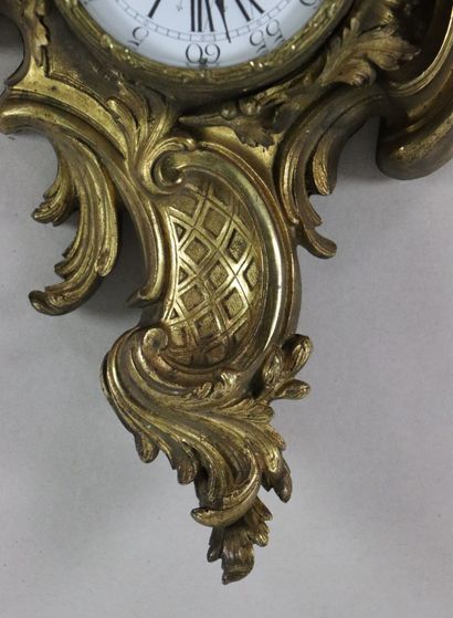 null Cartel d'applique en bronze ciselé et doré.

Style Louis XV, époque Napoléon...