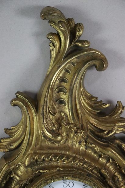 null Cartel d'applique en bronze ciselé et doré.

Style Louis XV, époque Napoléon...