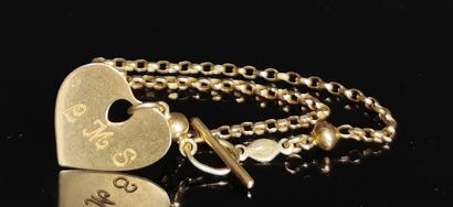 null Bracelet en or jaune orné d'un pendentif figurant un coeur gravé L.M.S.

4,58...