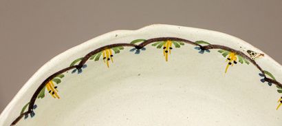 null NEVERS.
Earthenware salad bowl with polychrome decoration of a dog chasing a...