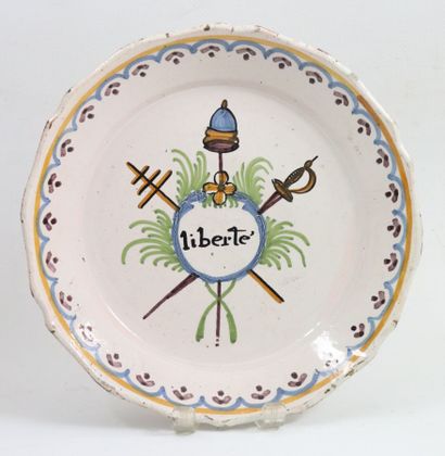 null NEVERS. 
Earthenware plate with revolutionary polychrome decoration of the three...