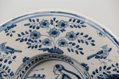 null NEVERS.
Earthenware tondino dish decorated in blue monochrome with a woman with...