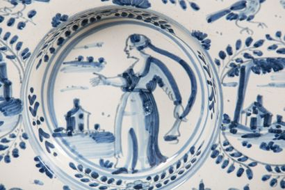 null NEVERS.
Earthenware tondino dish decorated in blue monochrome with a woman with...