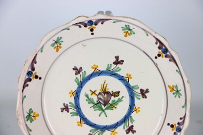 null NEVERS.
Earthenware plate with a polychrome revolutionary decoration of a flaming...