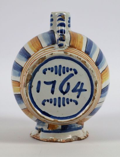 null NEVERS.
Earthenware barrel, decorated in blue and yellow-orange camaïeu, dated...