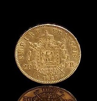 null Pièce de 20 francs or Napoléon III, tête laurée.
1868 A.
6,45 grammes, 18K,...