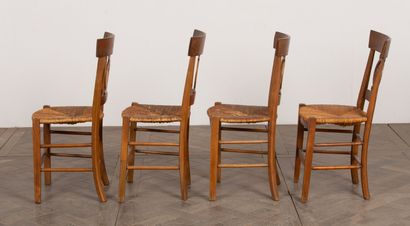 null Suite of four chairs with openwork backs decorated with architectures.
Directoire...