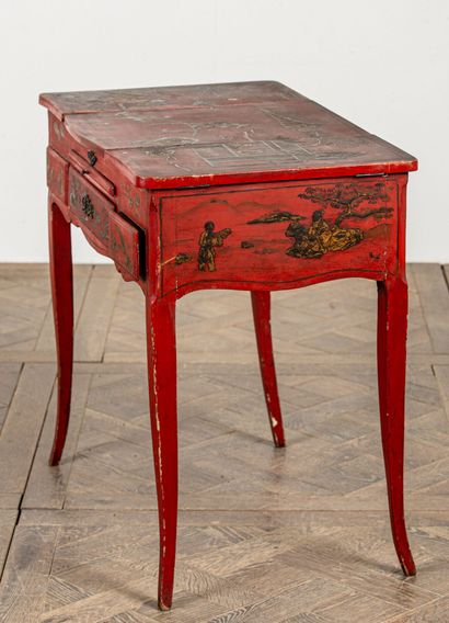 null Black and gold lacquered wood dressing table on a red background, with Chinese...